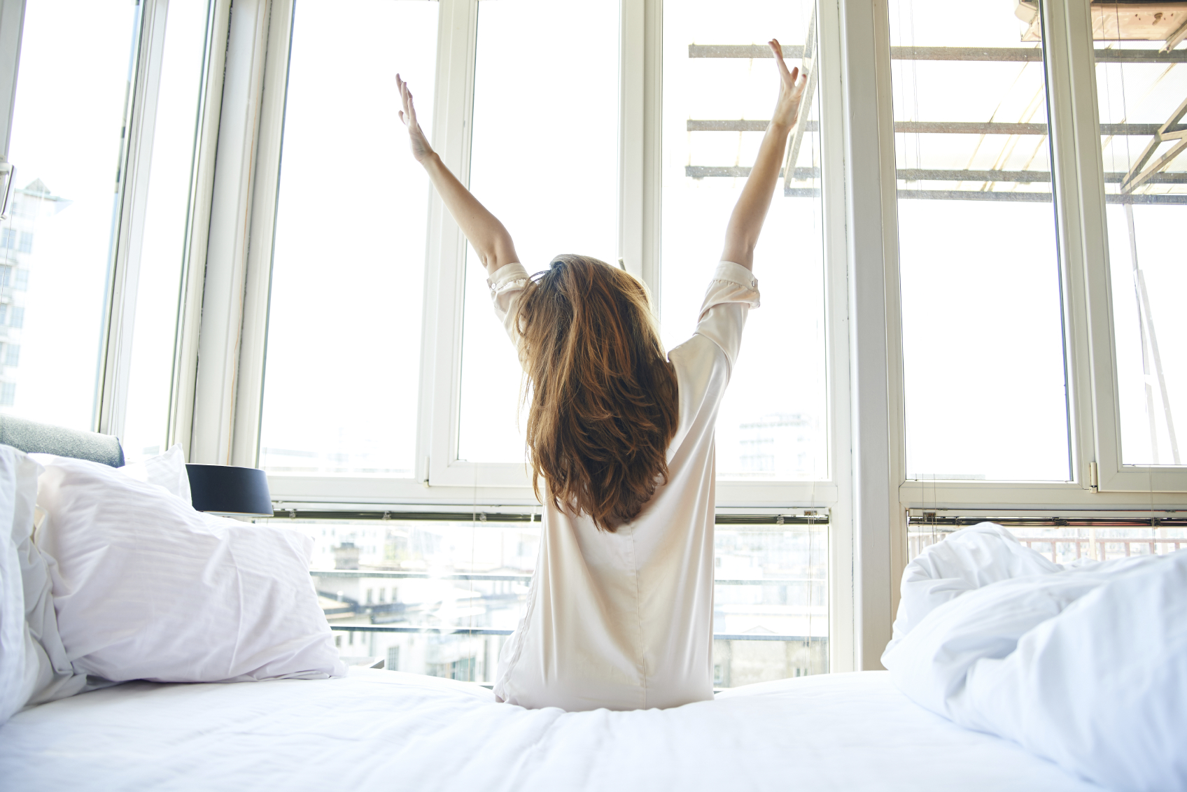 woman getting out of bed