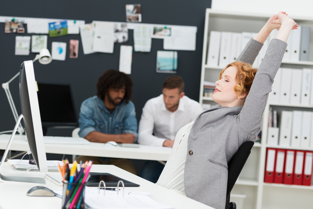 Woman Stretching at Desk