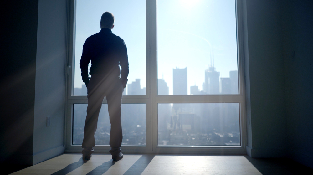 Man standing under sun